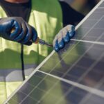 Technicians installing solar panels