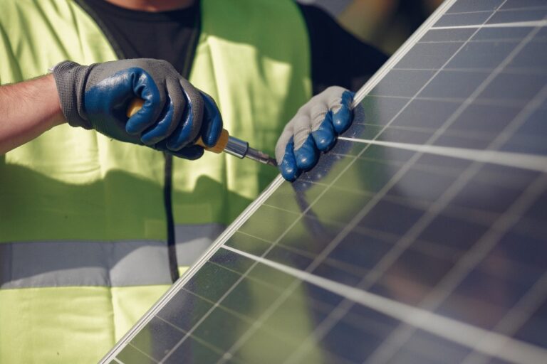 Technicians installing solar panels