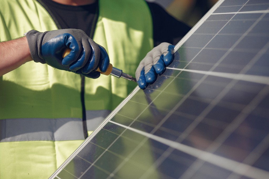 Technicians installing solar panels